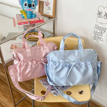 Satin balletcore laptop bag with soft ruffled bow and glossy finish, ideal for aesthetic outfits and everyday use