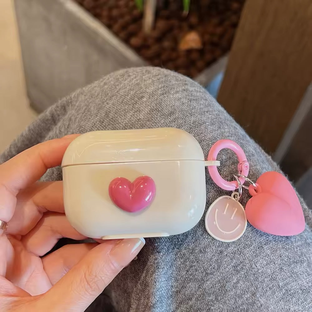 Stylish pink AirPods cover with heart charm keyring