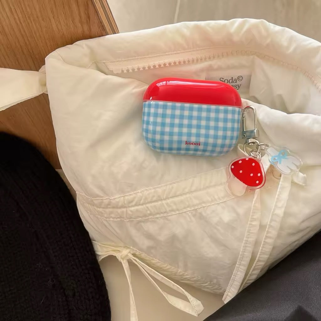 Kidcore-inspired AirPods cover with mushroom keychain
