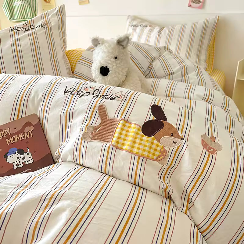 Children's bedroom with striped bedding featuring cartoon dog design, teddy bear, and book.