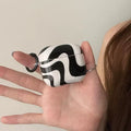 Black and white fashion AirPods case for unisex use with clip