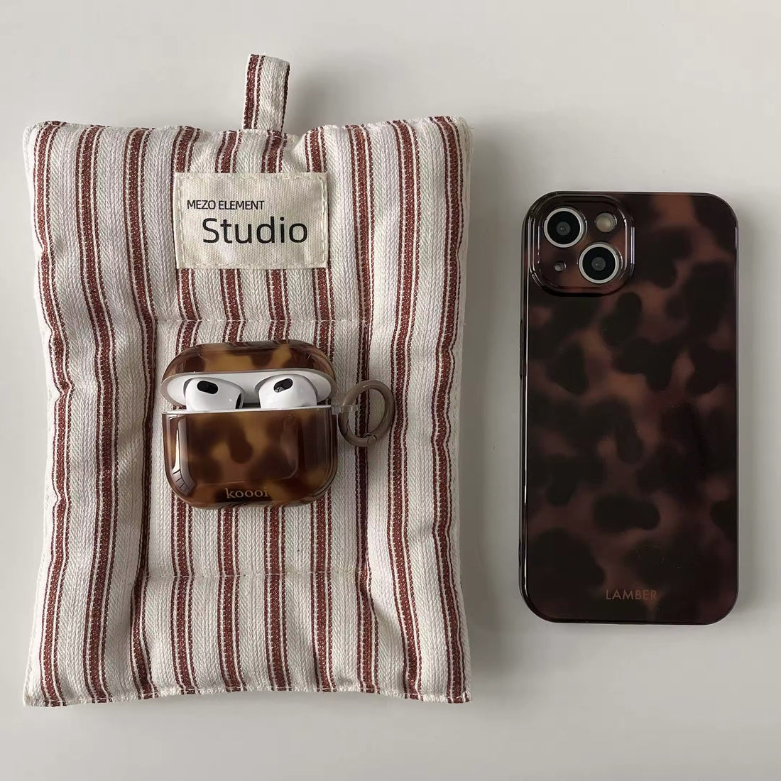 Amber swirl pattern AirPods case close-up