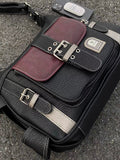 Alt girl handbag with bold buckles and structured silhouette