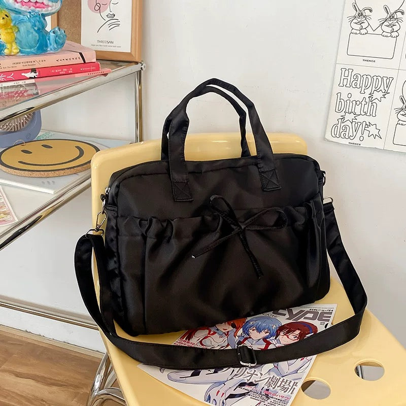 Harajuku-style shoulder bag with ruffles and bow detail, soft microfiber texture