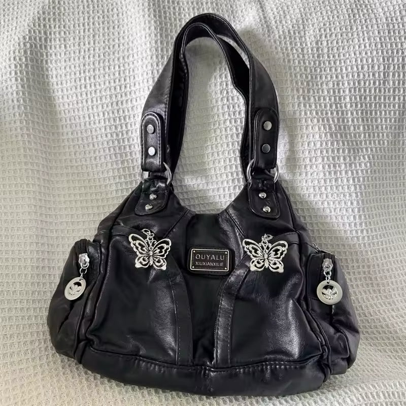 Grunge purse with adjustable strap on model