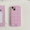 Pink lattice pattern iPhone case with a trendy coquette aesthetic