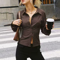 Modern vintage striped blouse with refined button details