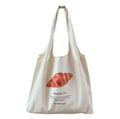 The tote placed on a café table, evoking a Parisian ambiance.