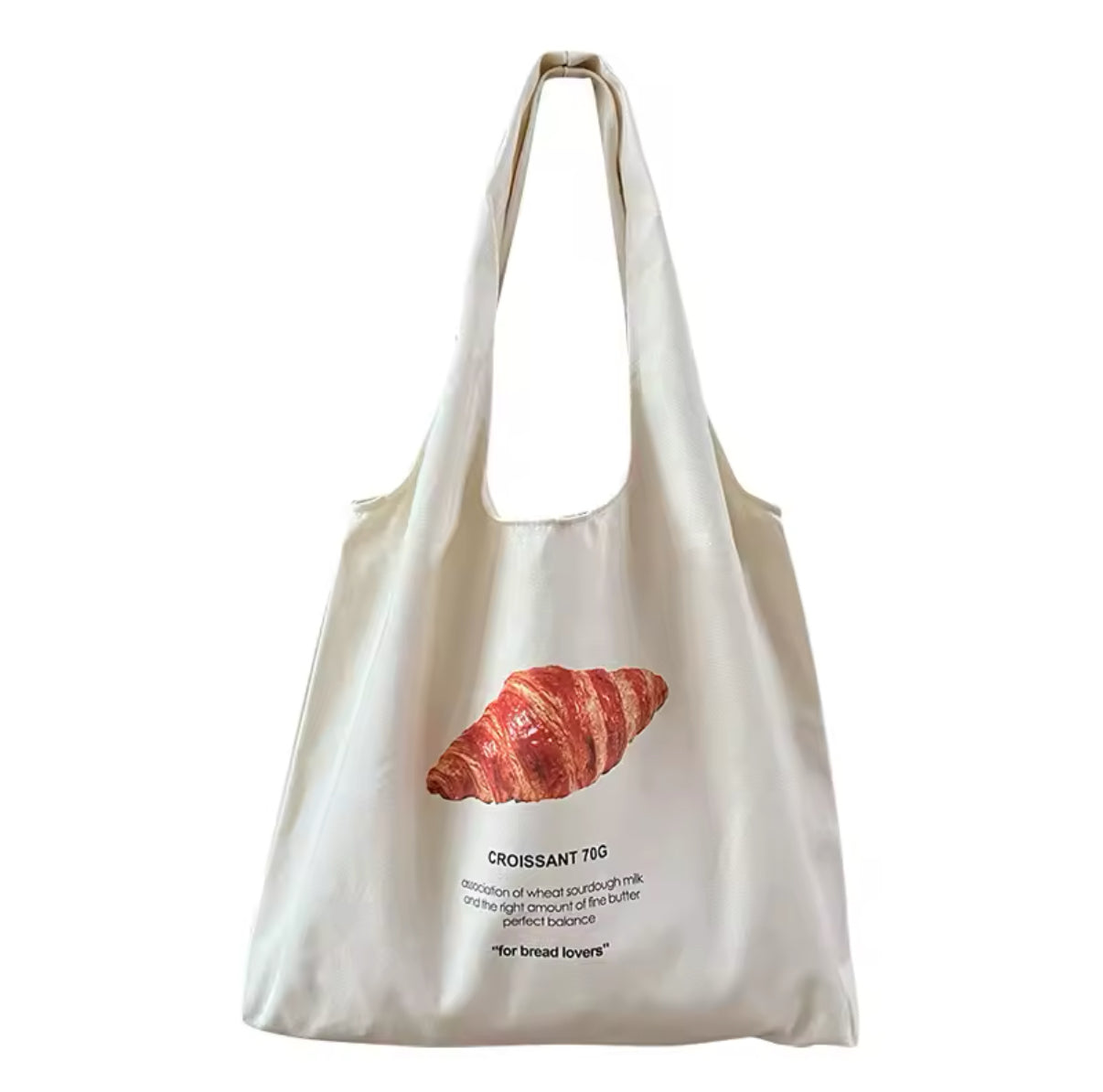 The tote placed on a café table, evoking a Parisian ambiance.