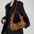 Brown solid color rivet tote with slouchy shape