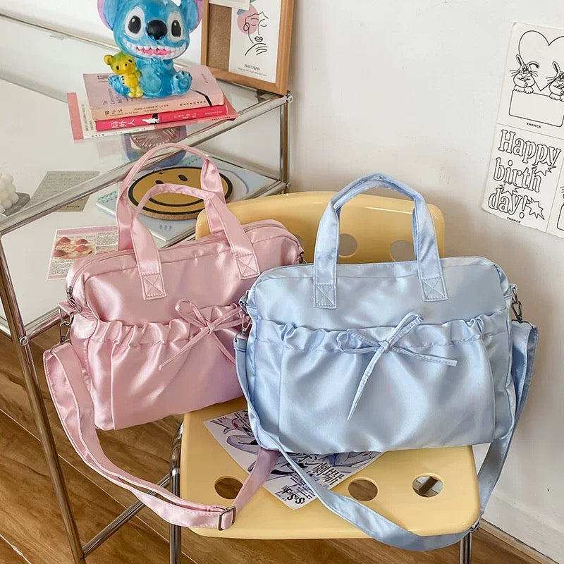 Satin balletcore laptop bag with soft ruffled bow and glossy finish, ideal for aesthetic outfits and everyday use