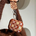 Cute coquette plaid AirPods case with brown checkered pattern and bow