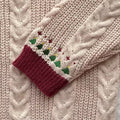 Retro-inspired winter cardigan with V-neck and folklore charm