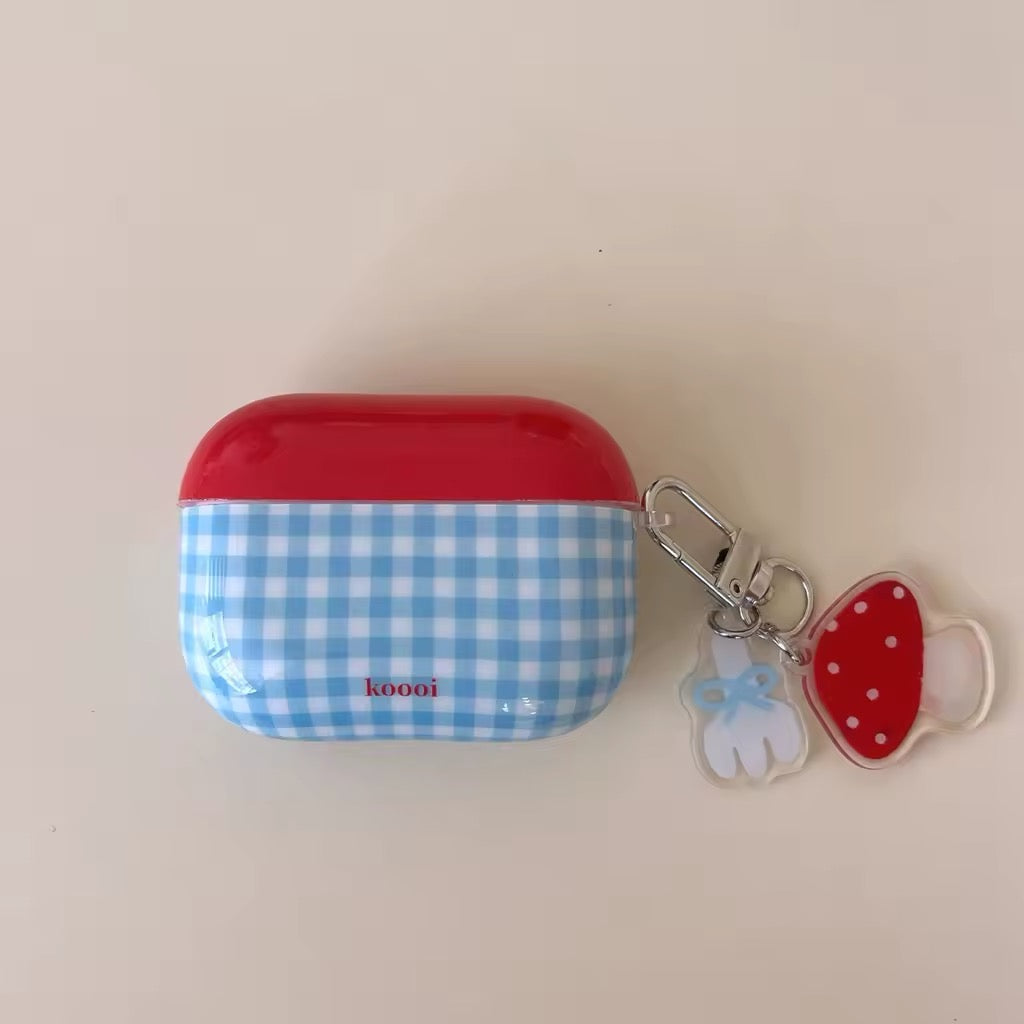 Close-up of mushroom charm AirPods case