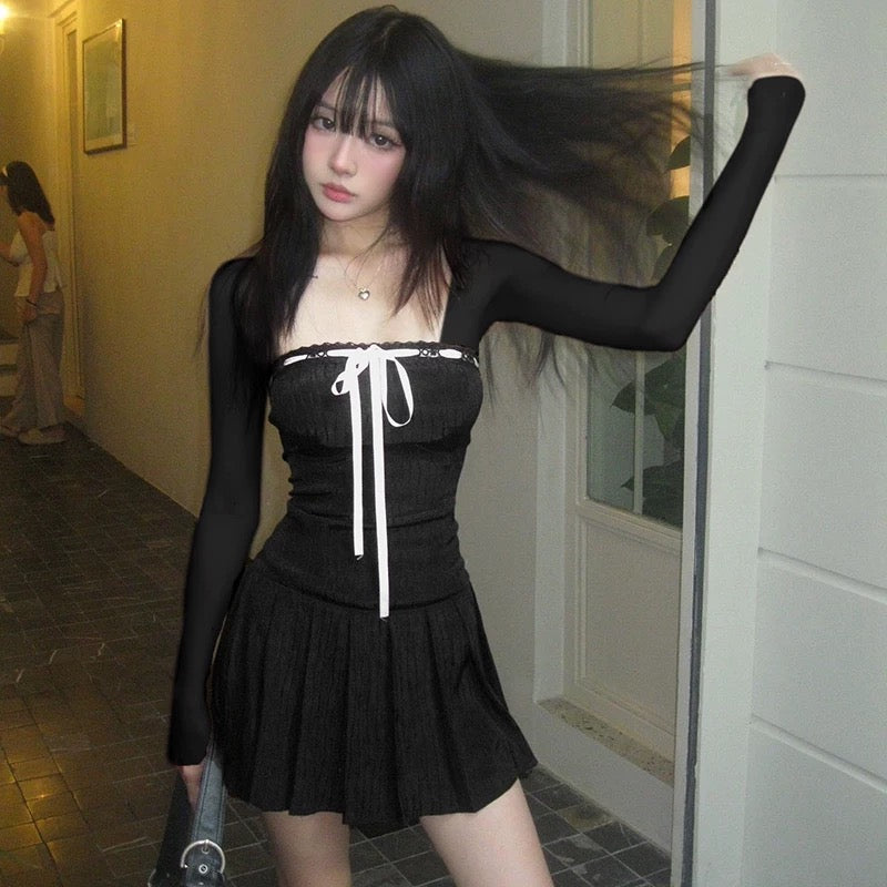 Dark aesthetic coquette dress with lace-up bow detail and long sleeves
