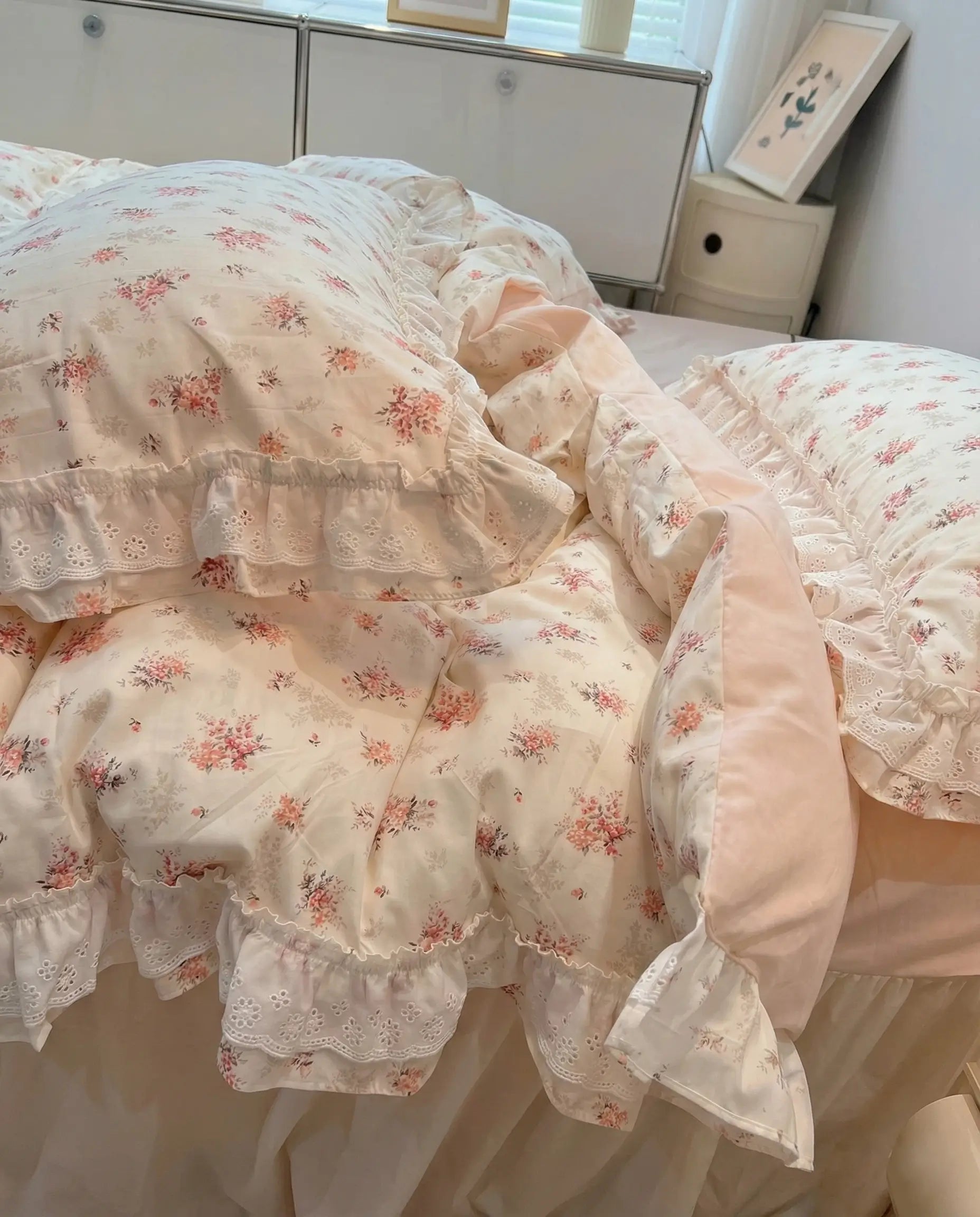 Floral patterned comforter on a bed in a bedroom setting