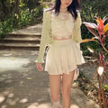 White high-waisted mini skirt with adjustable drawstrings
