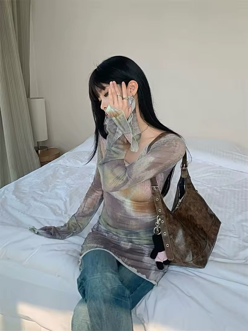 Full-body image of model styling the mesh top with layered necklaces and jeans, perfect for Y2K streetwear.