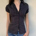 Chic retro striped blouse with a classic button-up aesthetic