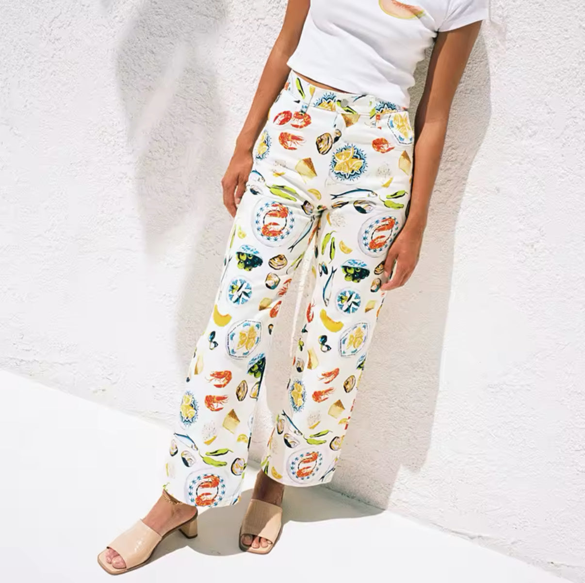 Fashionable Y2K style fruit print trousers with button closure