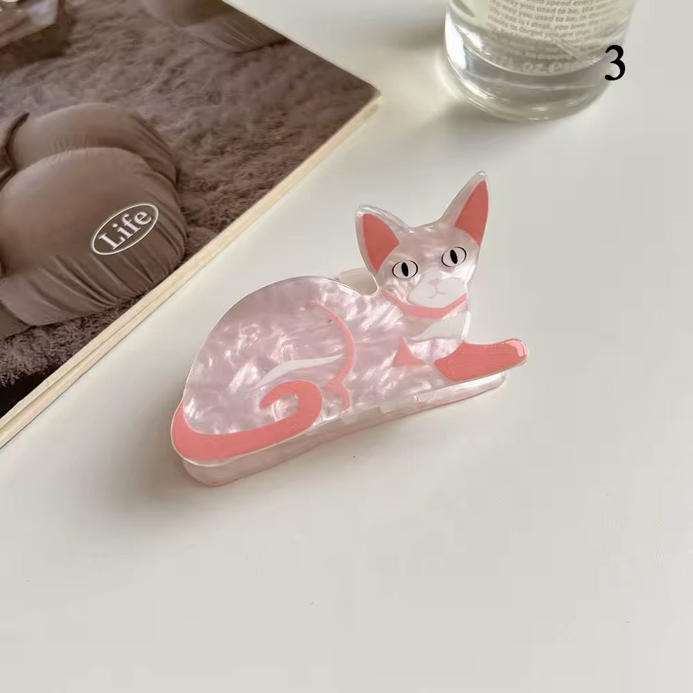 All six acetate cat clips arranged in a gradient from light to dark, enhancing the product’s playful variety