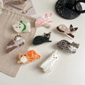 The pink pastel kitten hair claw clip with soft edges, designed for a cute, kawaii hair look