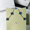 Romantic charm bracelet with four-leaf blue clover