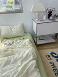 Bedroom with a bed, nightstand, and decorative elements.