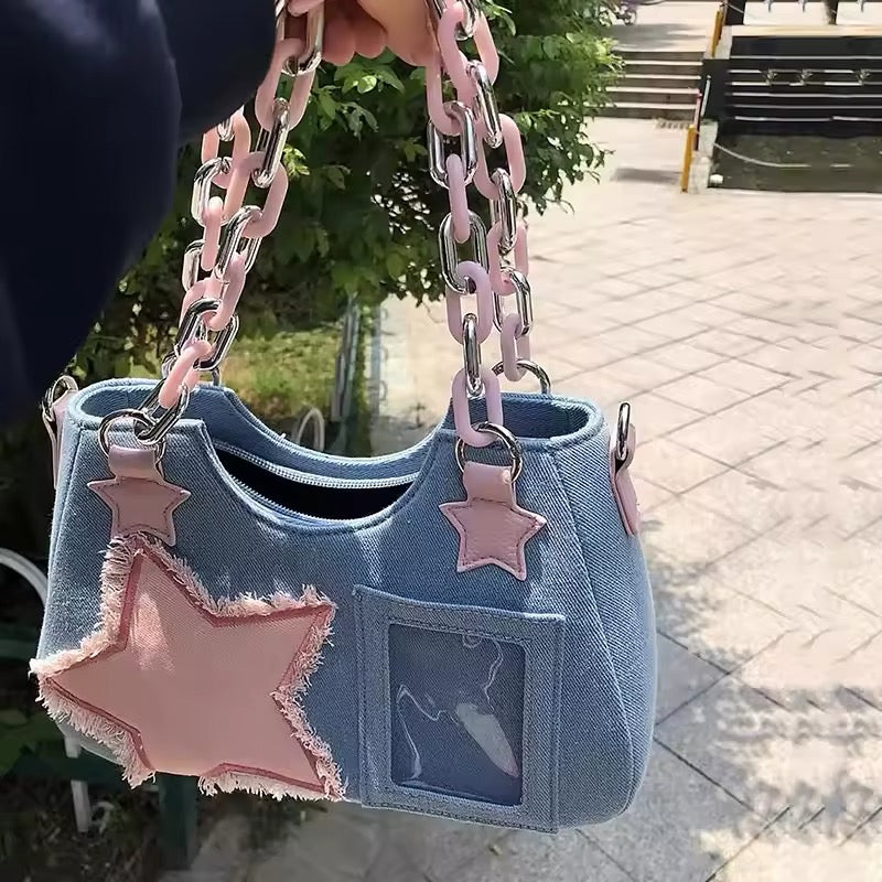 Grunge aesthetic tote with frayed pink star and chain strap