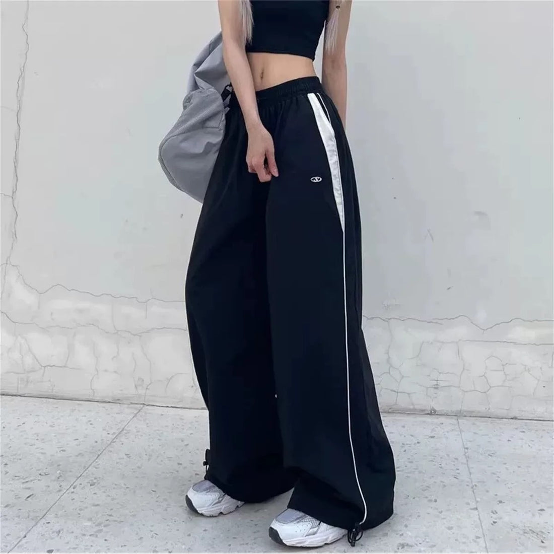 y2k black pants with white stripe design