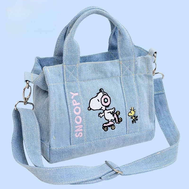 Kawaii embroidered crossbody Snoopy bag on display