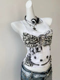 Japanese streetwear outfit featuring the Hello Kitty corset cami with high-waisted jeans