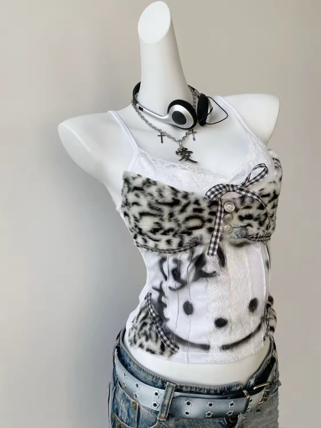 Japanese streetwear outfit featuring the Hello Kitty corset cami with high-waisted jeans