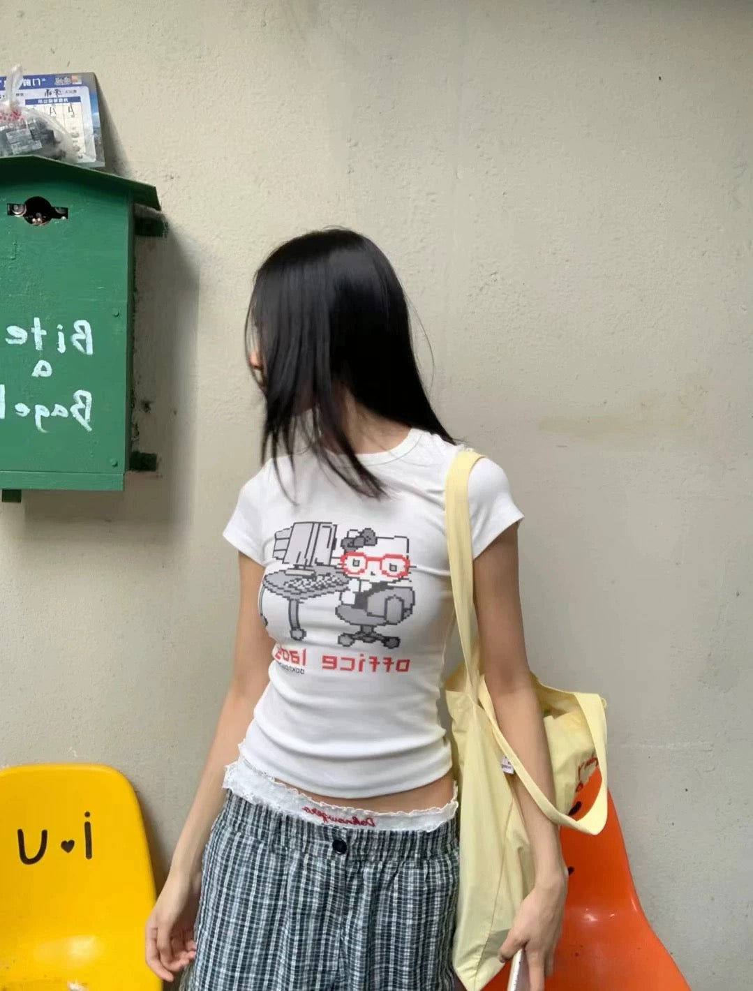 Front view of Y2K Hello Kitty graphic t-shirt with kawaii design and slim fit
