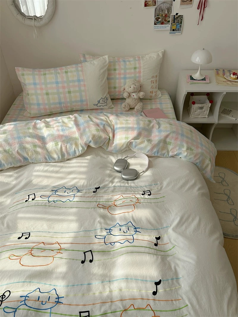 Bed with cartoon-themed bedding in a bedroom setting