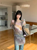 Model posing indoors, showing the soft flare of the sleeves and iridescent mesh sheen.