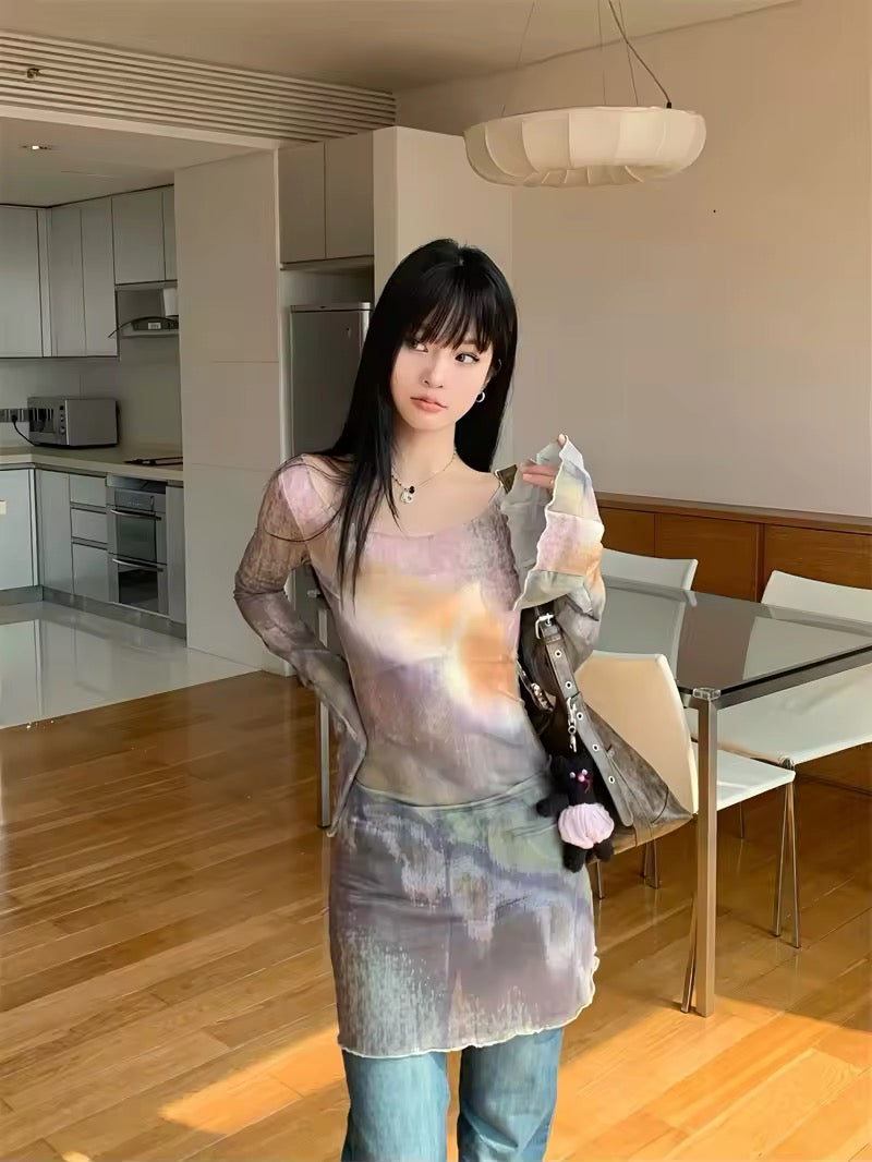 Model posing indoors, showing the soft flare of the sleeves and iridescent mesh sheen.