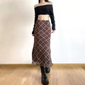 Stylish plaid midi skirt with a trendy side slit

