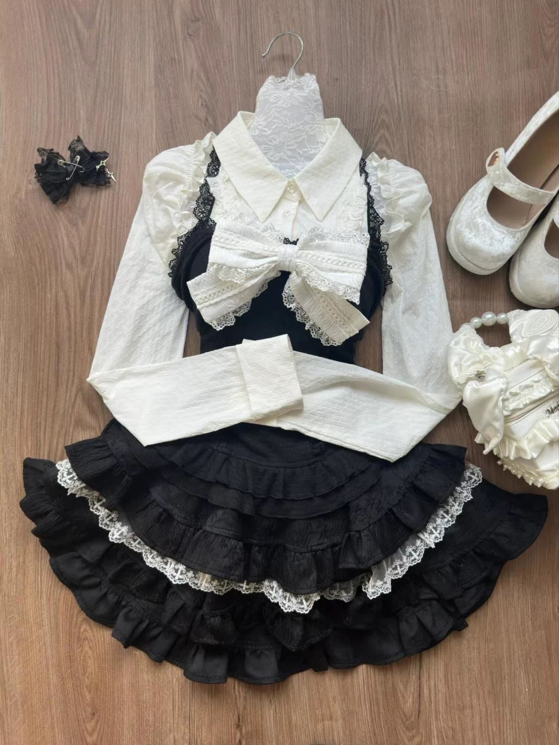 Kawaii Japanese Lolita outfit with bow shirt and ruffled skirt