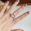 Silver ring on soft girl aesthetic hand