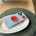Cute food-themed iPhone case with red tomato and bracket