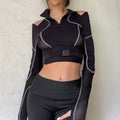 Mall Goth aesthetic hollow-out crop top, cyberpunk-inspired long sleeve tee, grunge Y2K fashion with mesh patchwork, sexy alternative streetwear