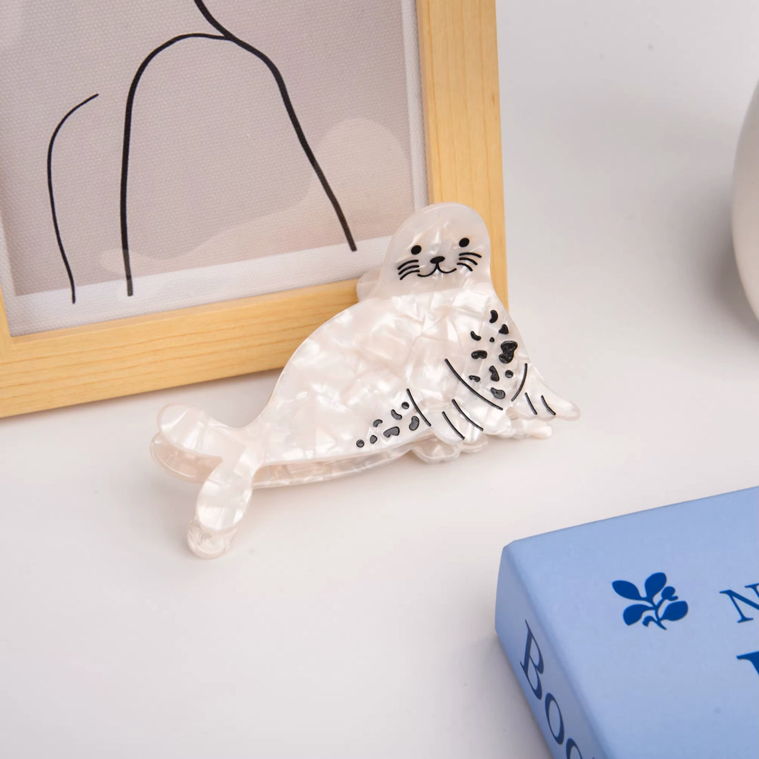 White seal hair claw with a cute marine animal design