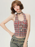 Back view displaying the open back and halter neckline of the crop top.