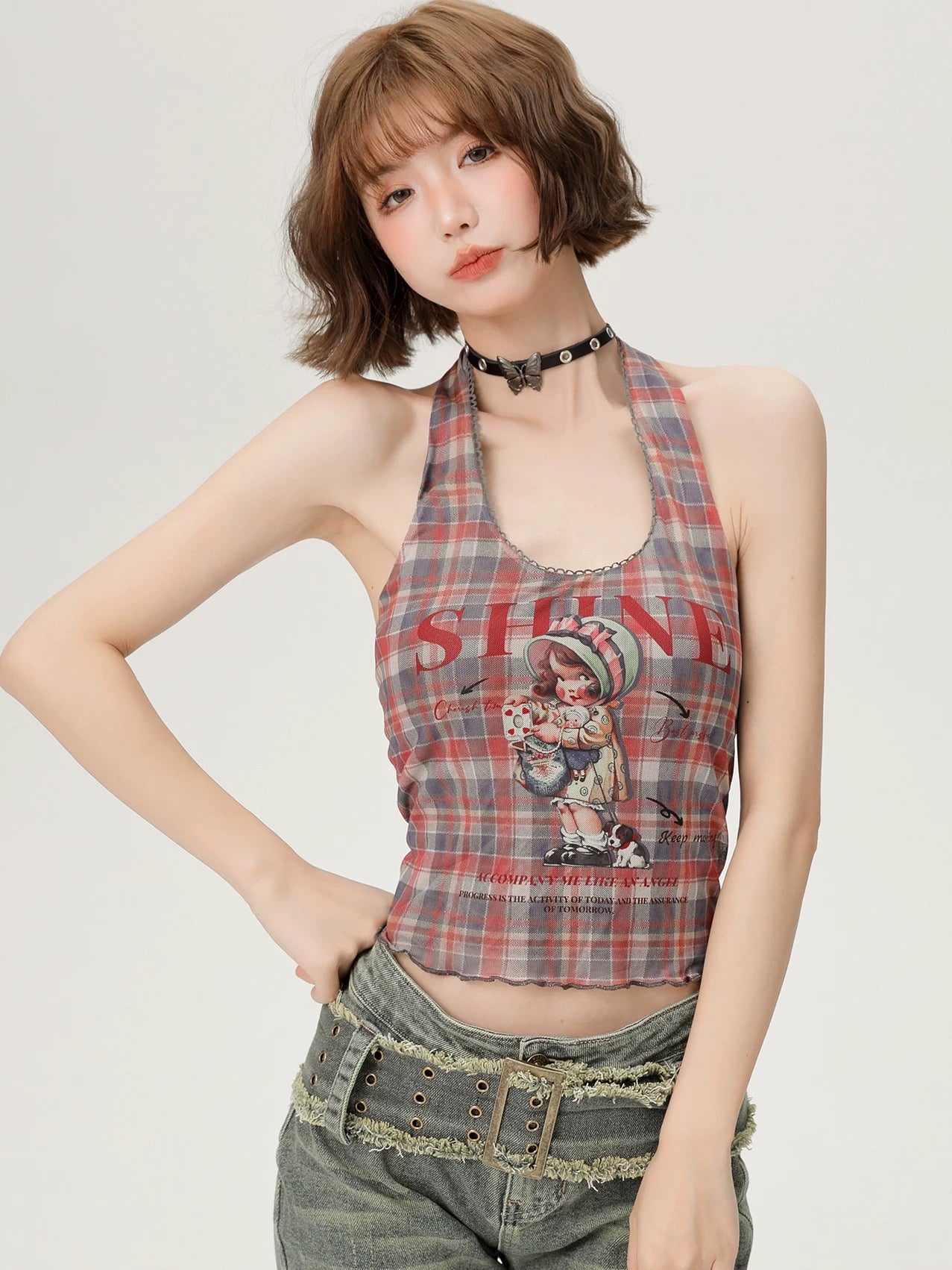 Back view displaying the open back and halter neckline of the crop top.