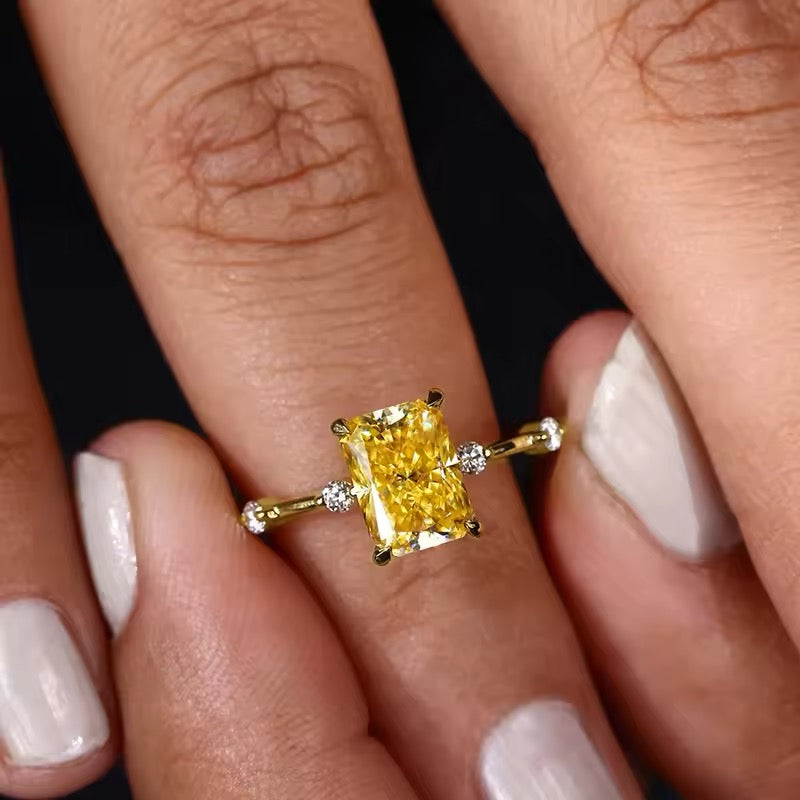 Elegant yellow crystal ring on white background