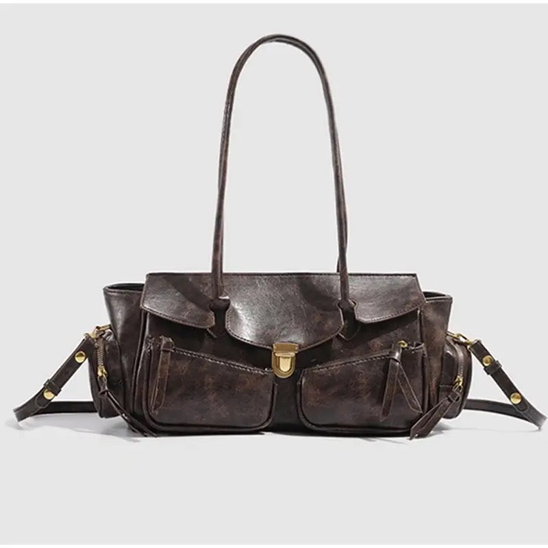 Grunge-style shoulder bag with long strap and Y2K retro vibe