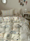 Bed with colorful bedding and pillows in a bedroom setting