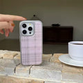 The iPhone case being held by a user, showcasing its ergonomic design