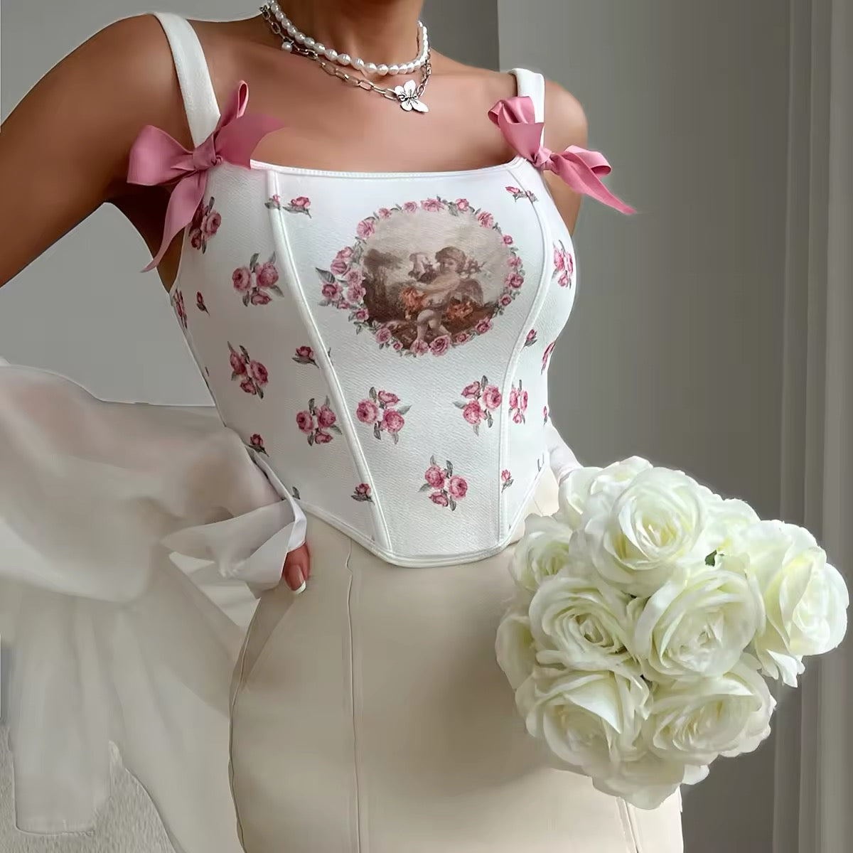 Pink coquette corset with lace and bow details for vintage-inspired outfits